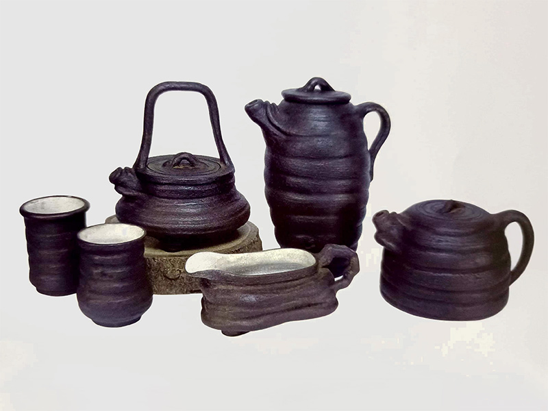 裴石民制悟奇陶圈形壶杯套组